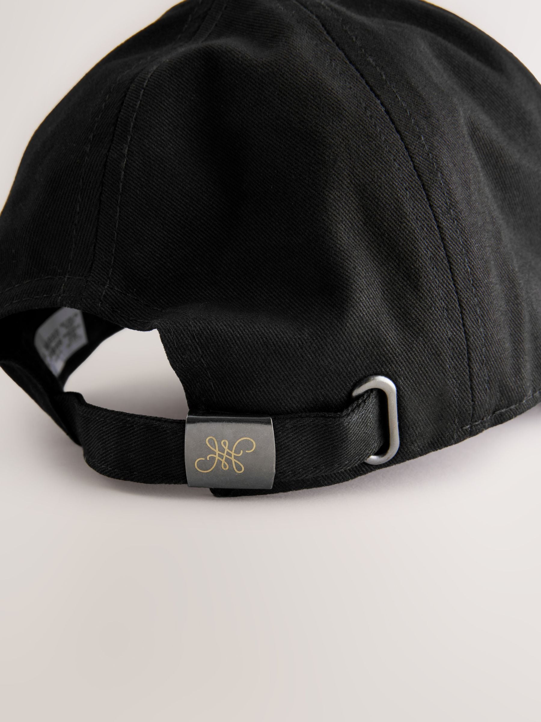 Black high build embroidery cap with curved brim (British brand)