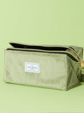 Flat Lay Co. sage green velvet makeup bag (British brand)