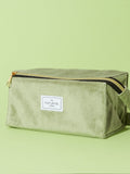 Flat Lay Co. sage green velvet makeup bag (British brand)