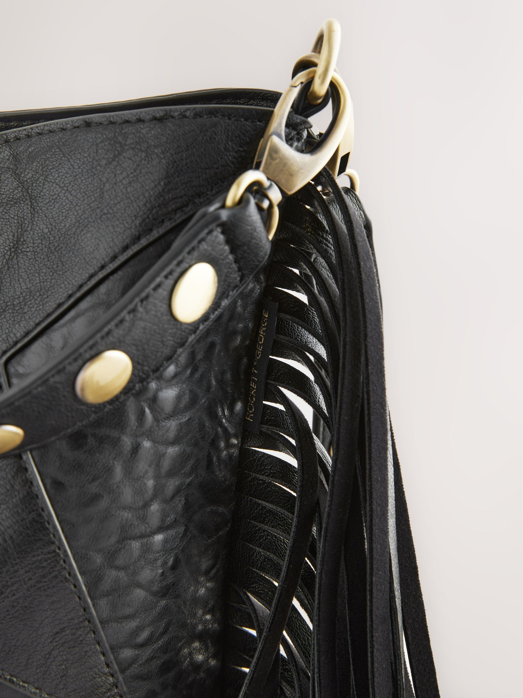 Rockett St George black studded star cross-body bucket bag (British brand)