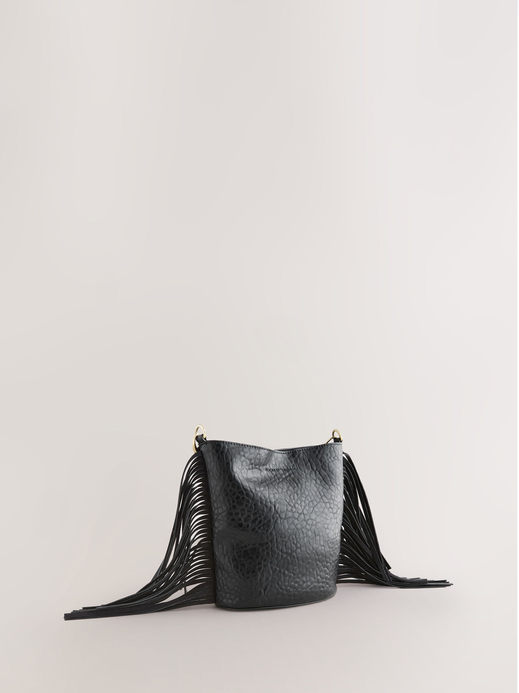 Rockett St George black studded star cross-body bucket bag (British brand)
