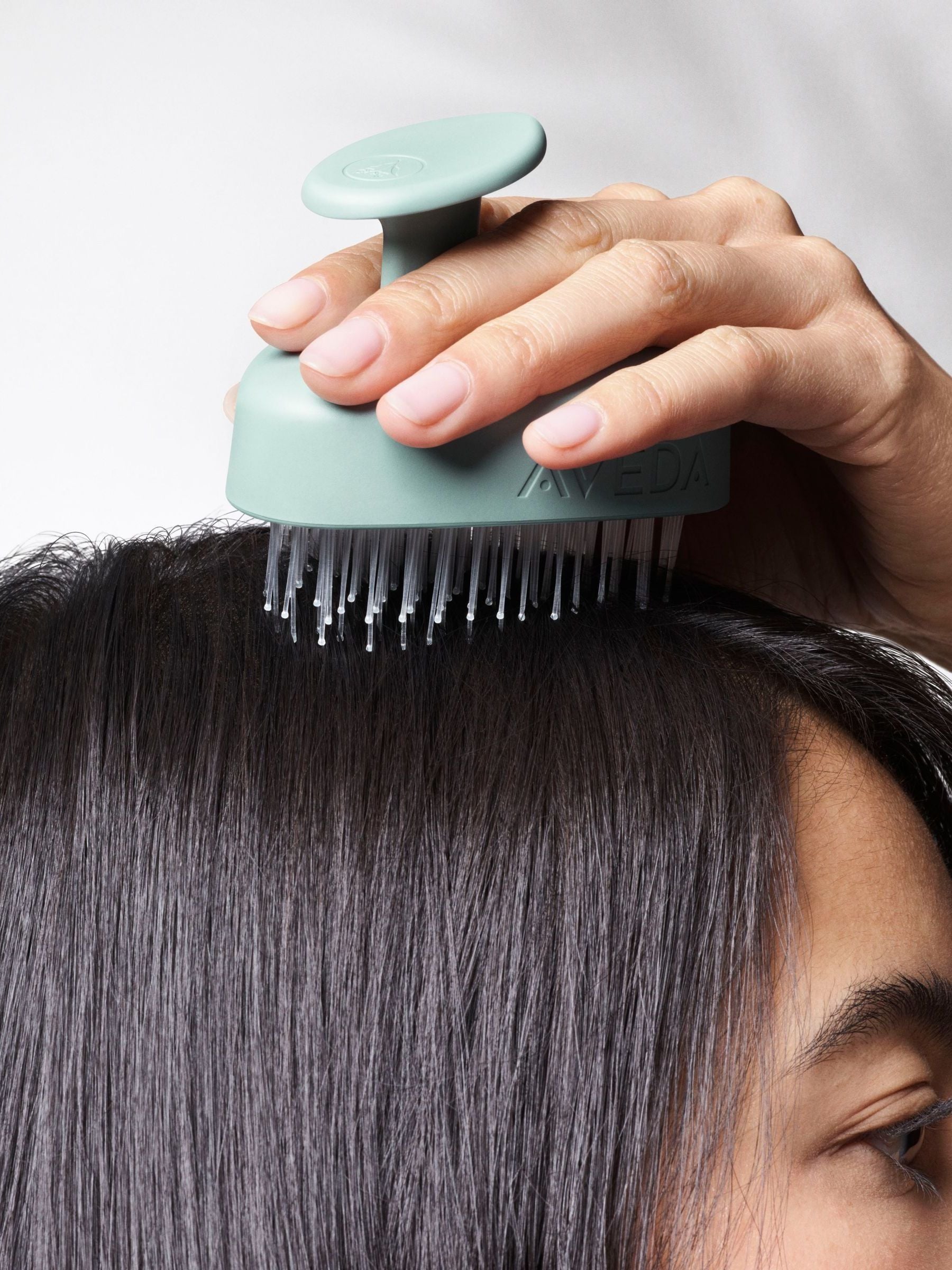 Aveda scalp massager with flexible bristles, imported from the UK