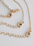 Gold tone pearl effect 3 layer necklace, UK version