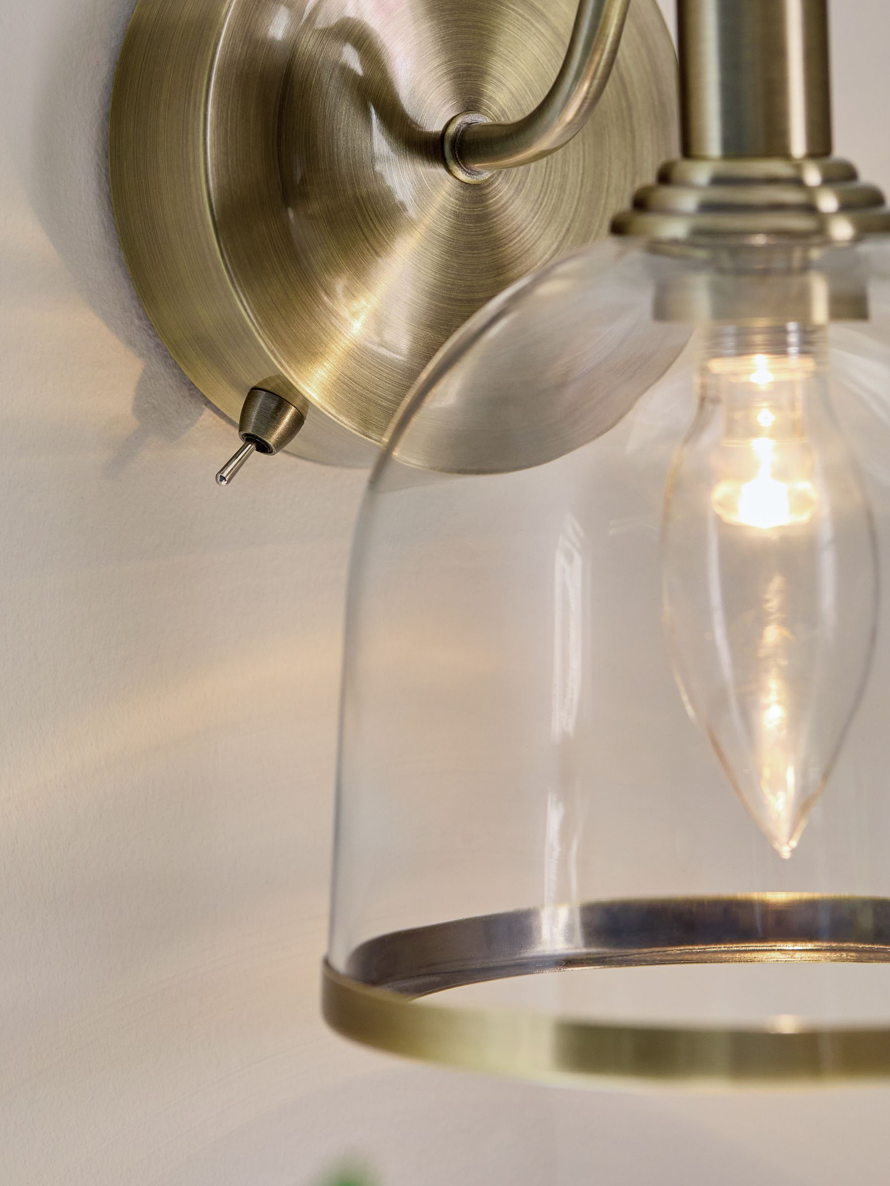 Gloucester wall light with clear glass and brass accents, UK version