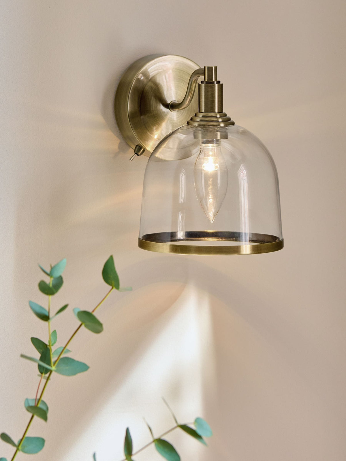 Gloucester wall light with clear glass and brass accents, UK version