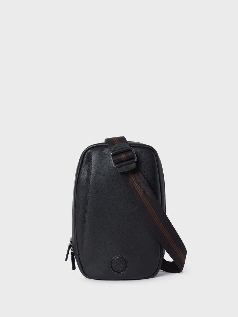 OSPREY LONDON black leather compass sling bag, imported from the UK