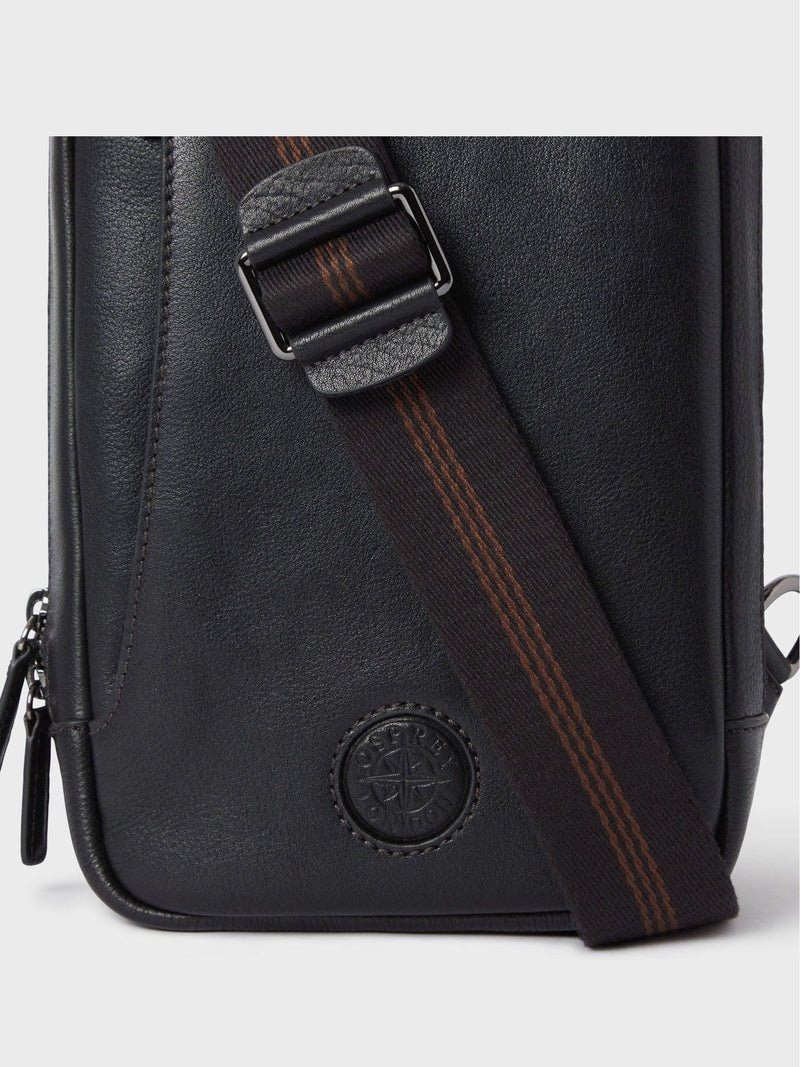 OSPREY LONDON black leather compass sling bag, imported from the UK
