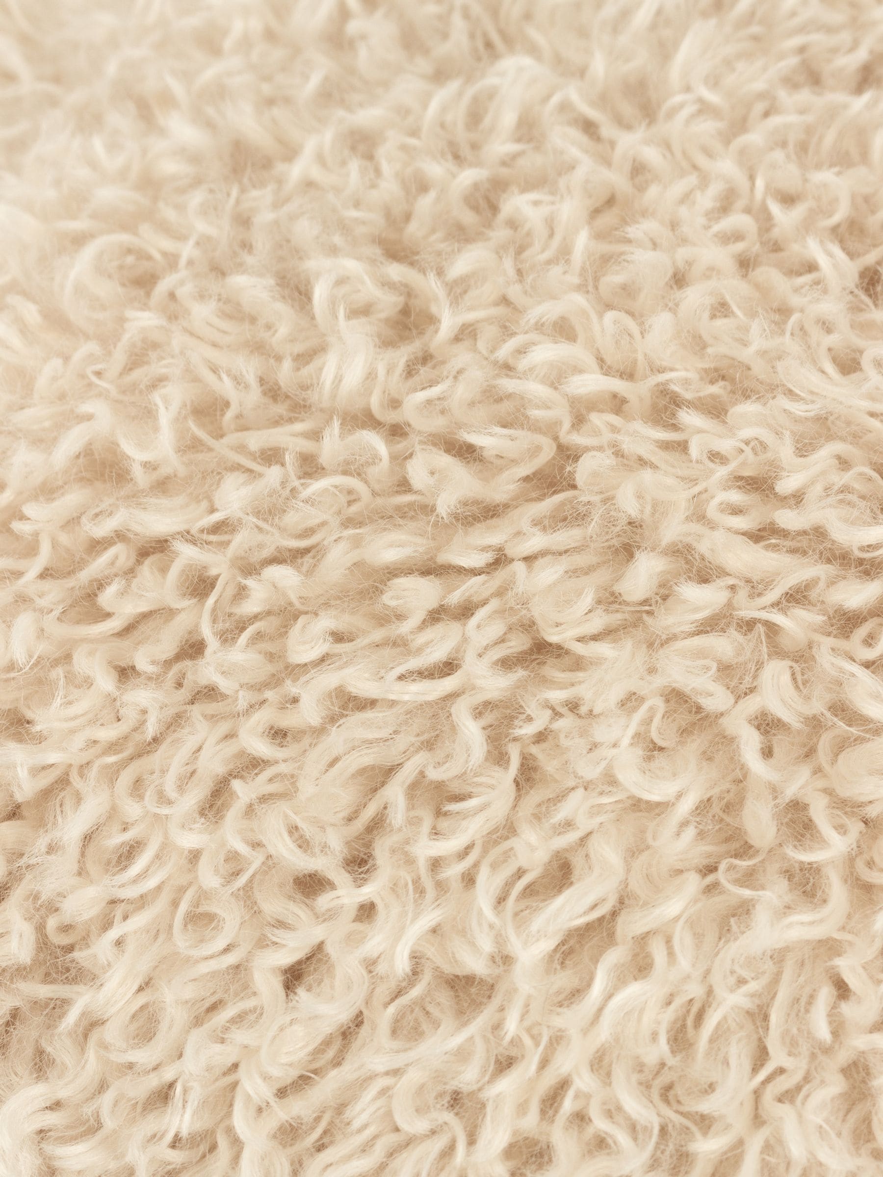 Furn natural beige faux fur cushion, imported from the UK