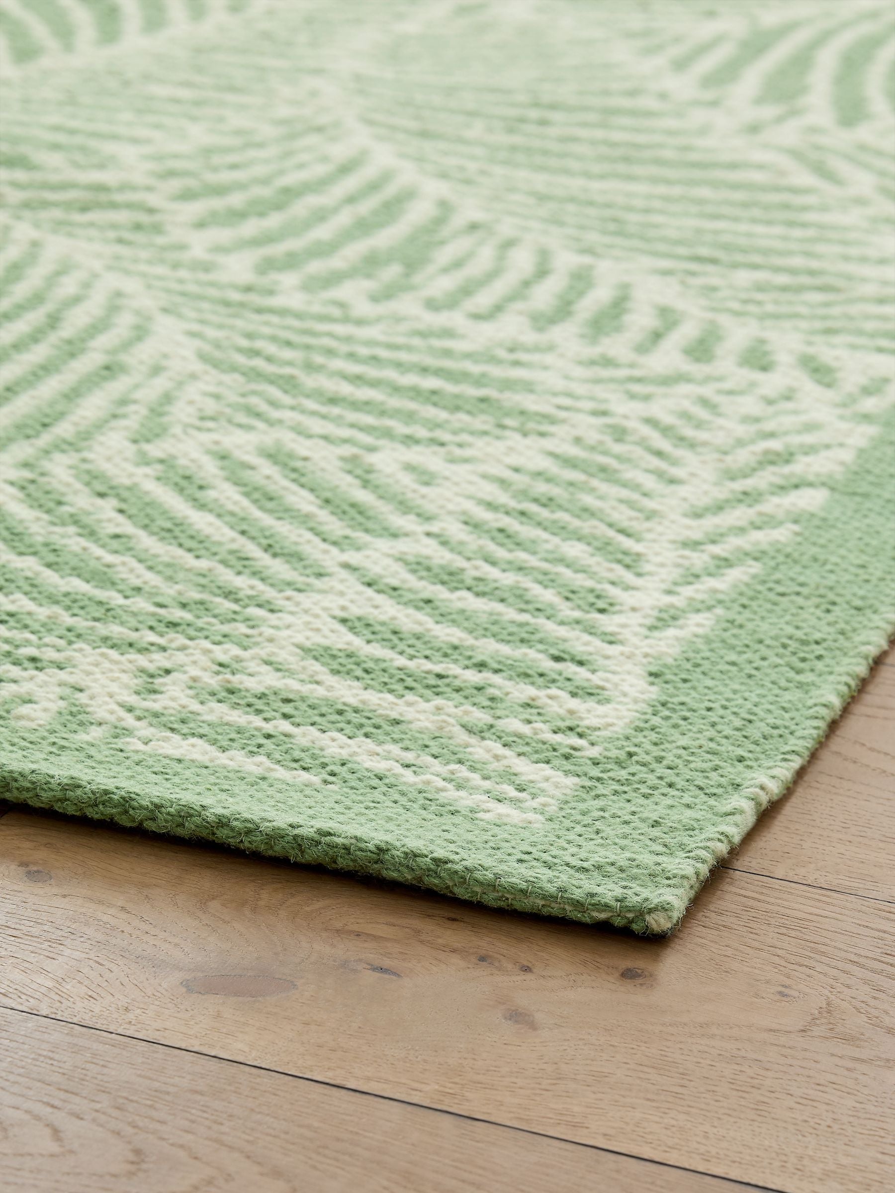 Nina Campbell green tree fern flatweave wool rug (British brand)