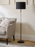 Sosandar black floor lamp with amber glass base, imported from the UK