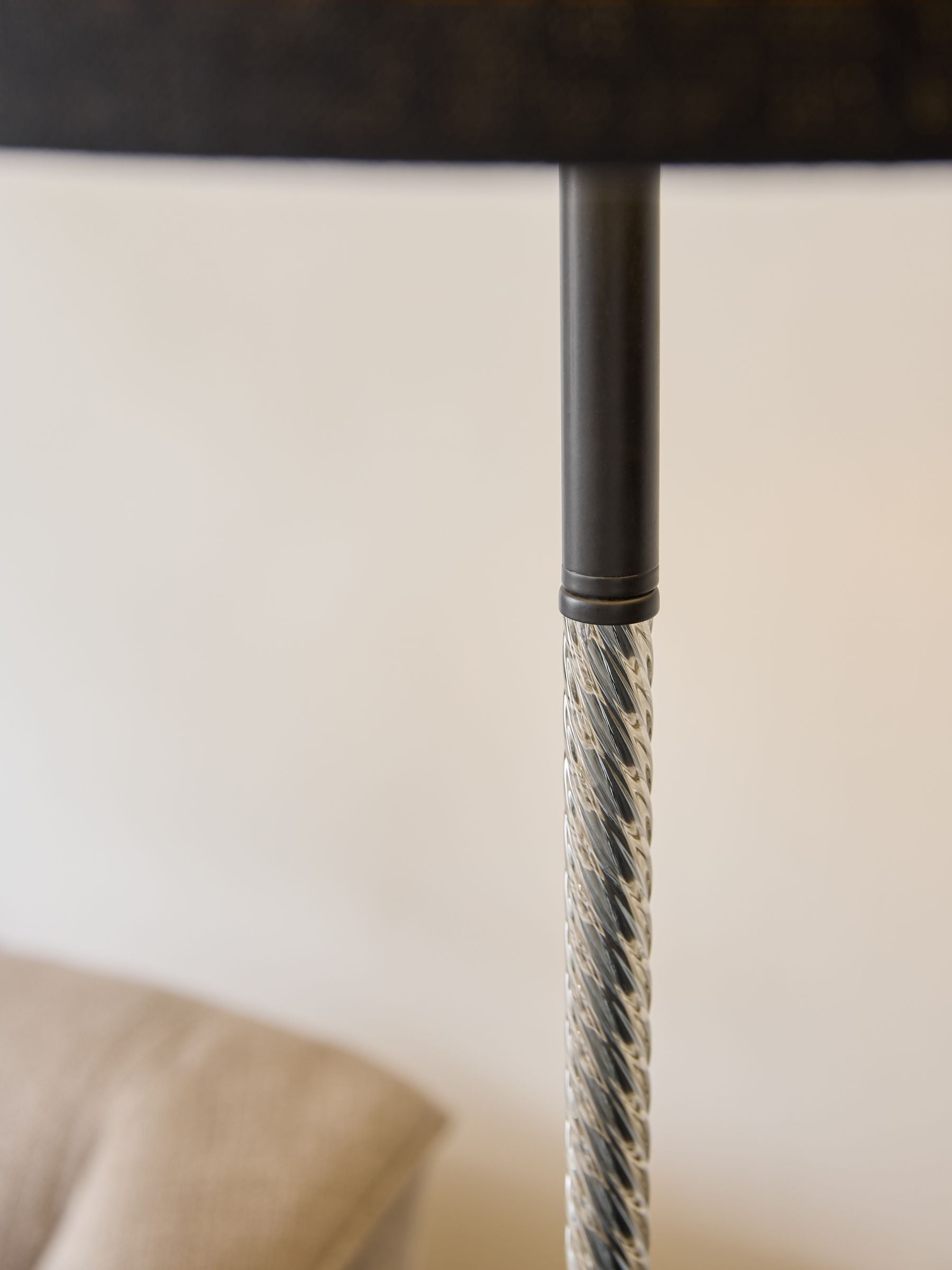 Sosandar black floor lamp with amber glass base, imported from the UK
