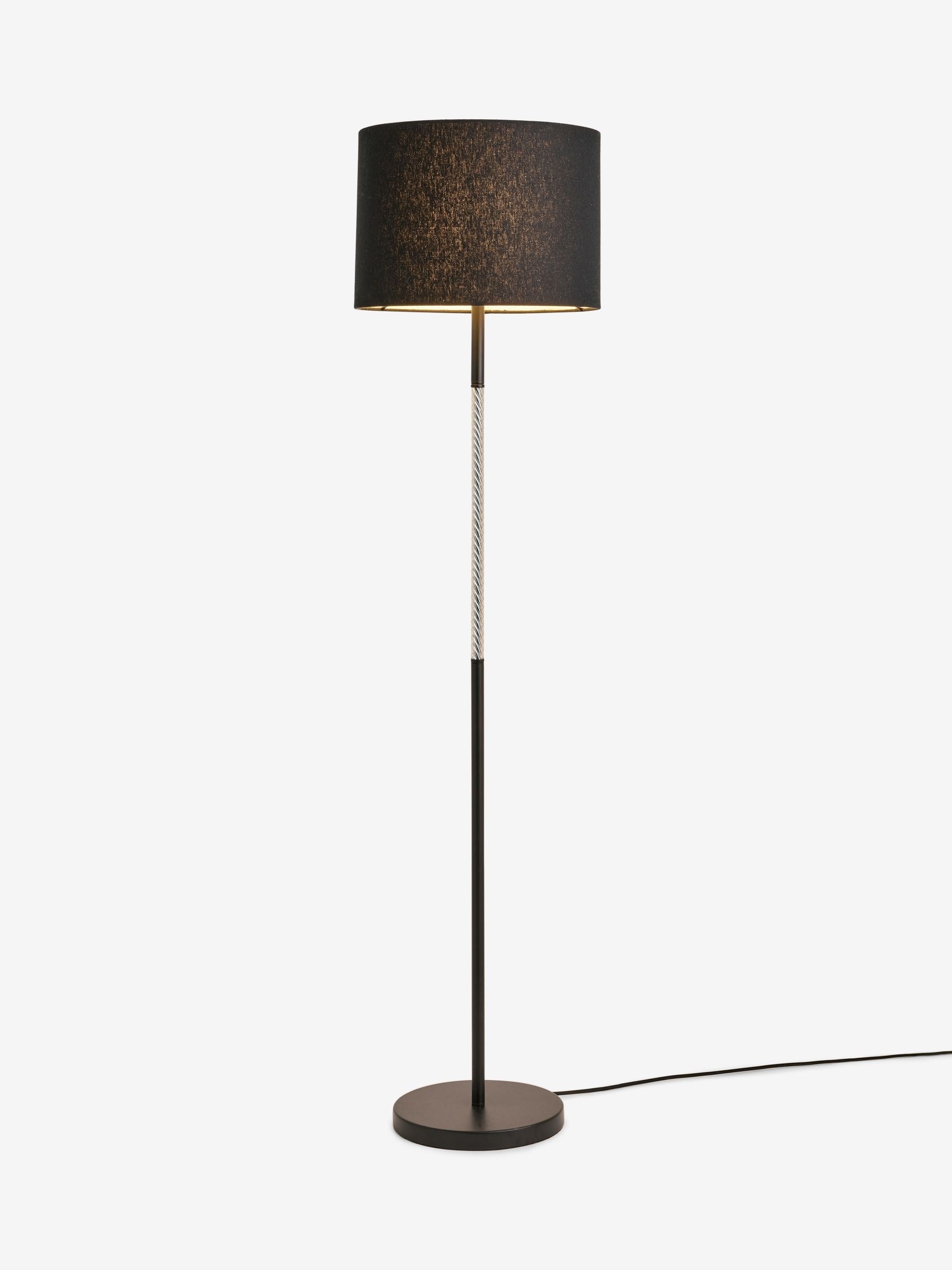 Sosandar black floor lamp with amber glass base, imported from the UK