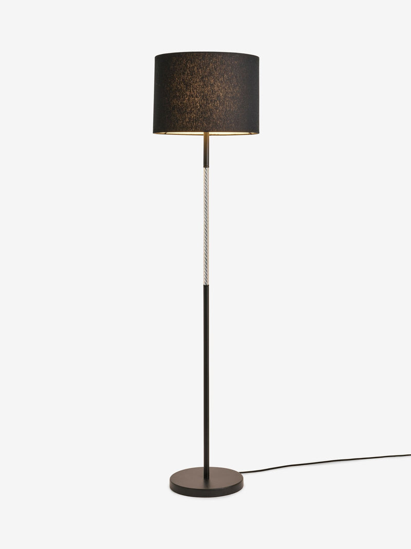 Sosandar black floor lamp with amber glass base, imported from the UK