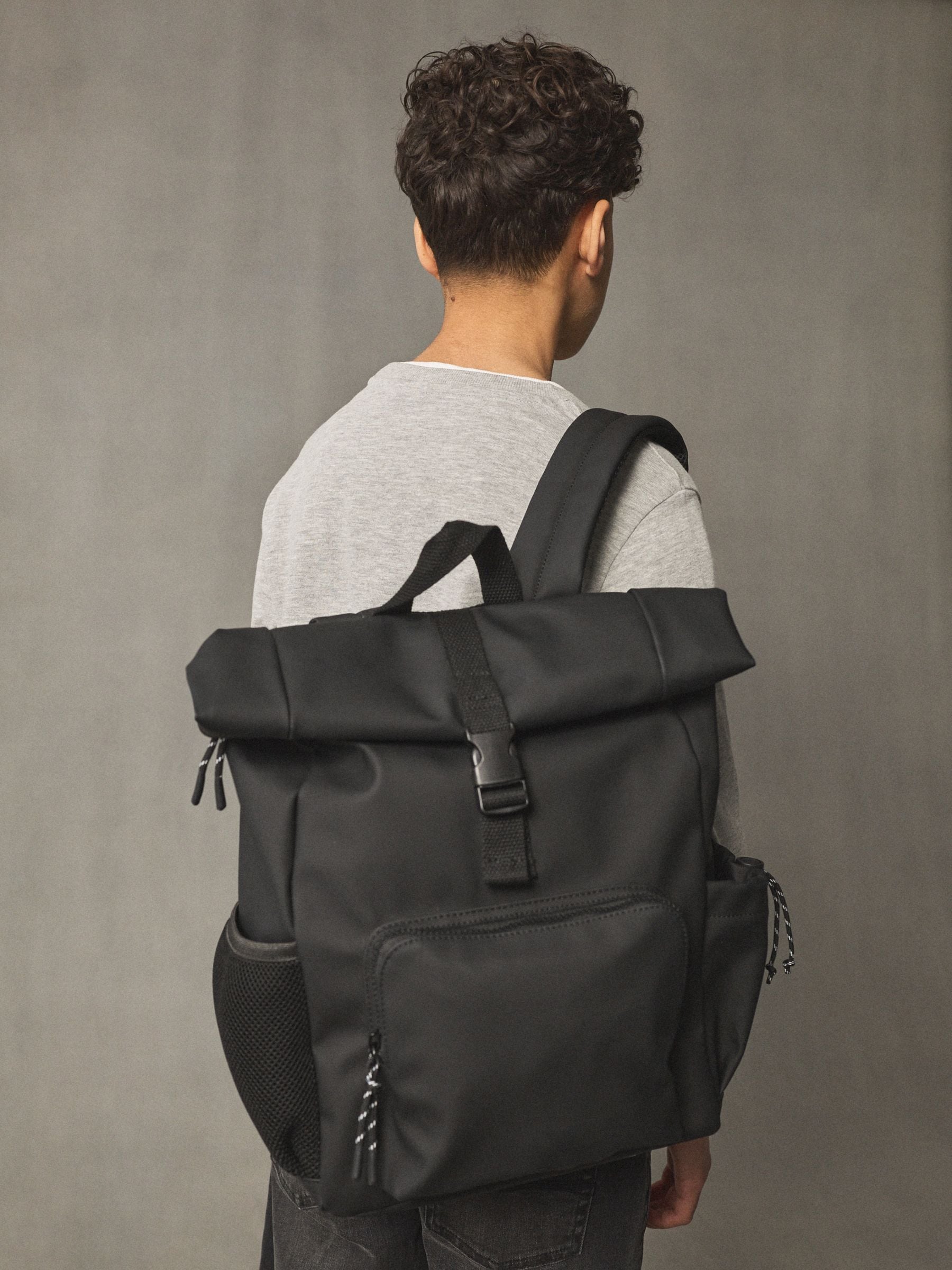 Black roll top backpack polyurethane construction - British product