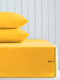 Sábana bajera ajustable extra profunda de algodón de color amarillo brillante - Producto británico
