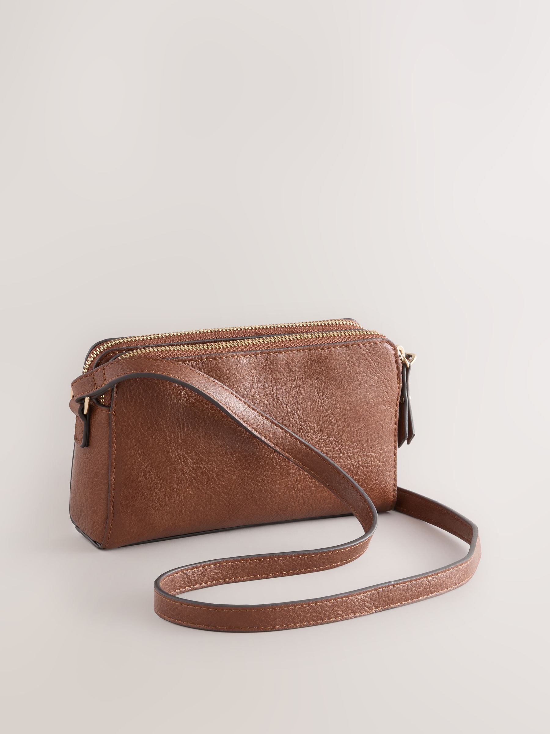 Black double zip cross body bag with adjustable strap, imported from the UK