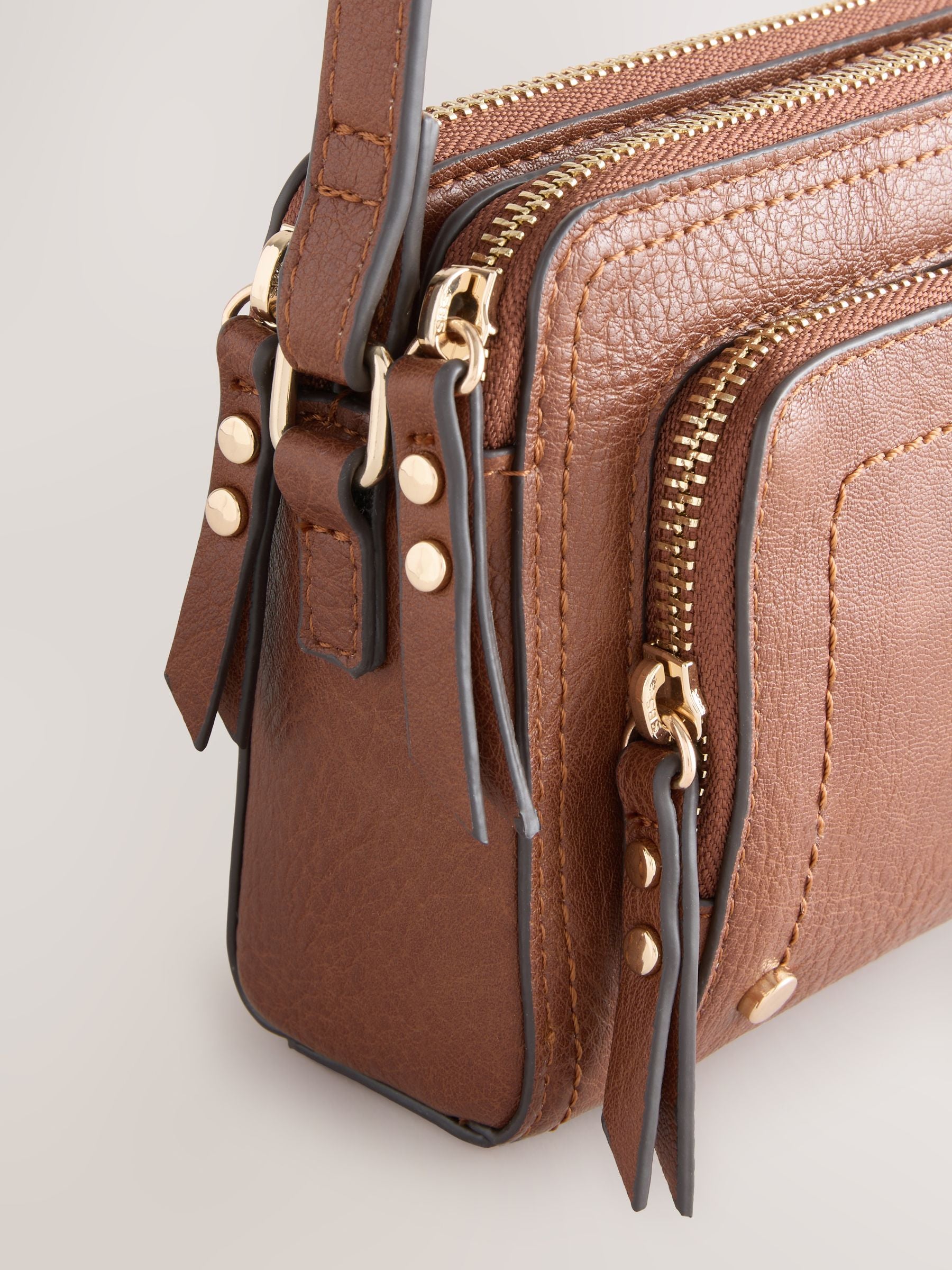 Black double zip cross body bag with adjustable strap, imported from the UK