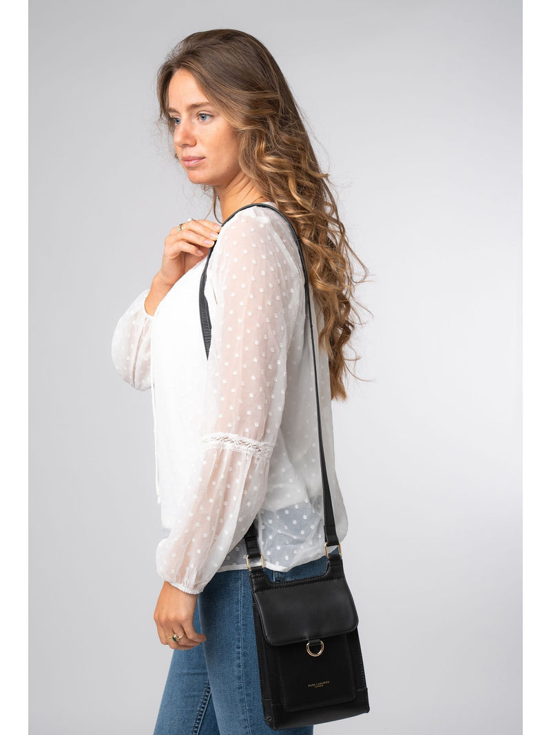 Pure Luxuries London black Erma leather cross-body bag, imported from the UK