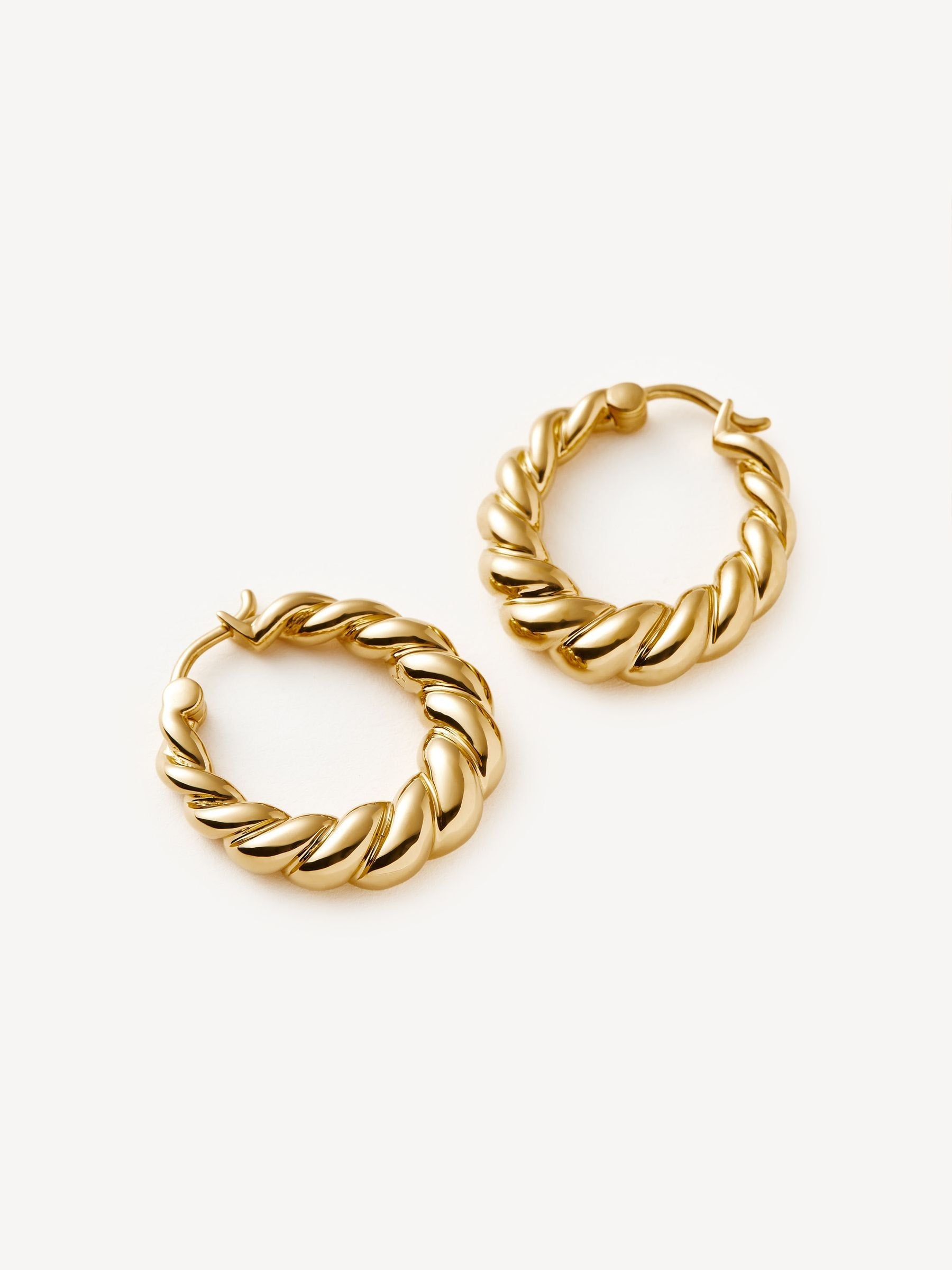 Missoma gold tone twisted tidal small hoop earrings, imported from the UK