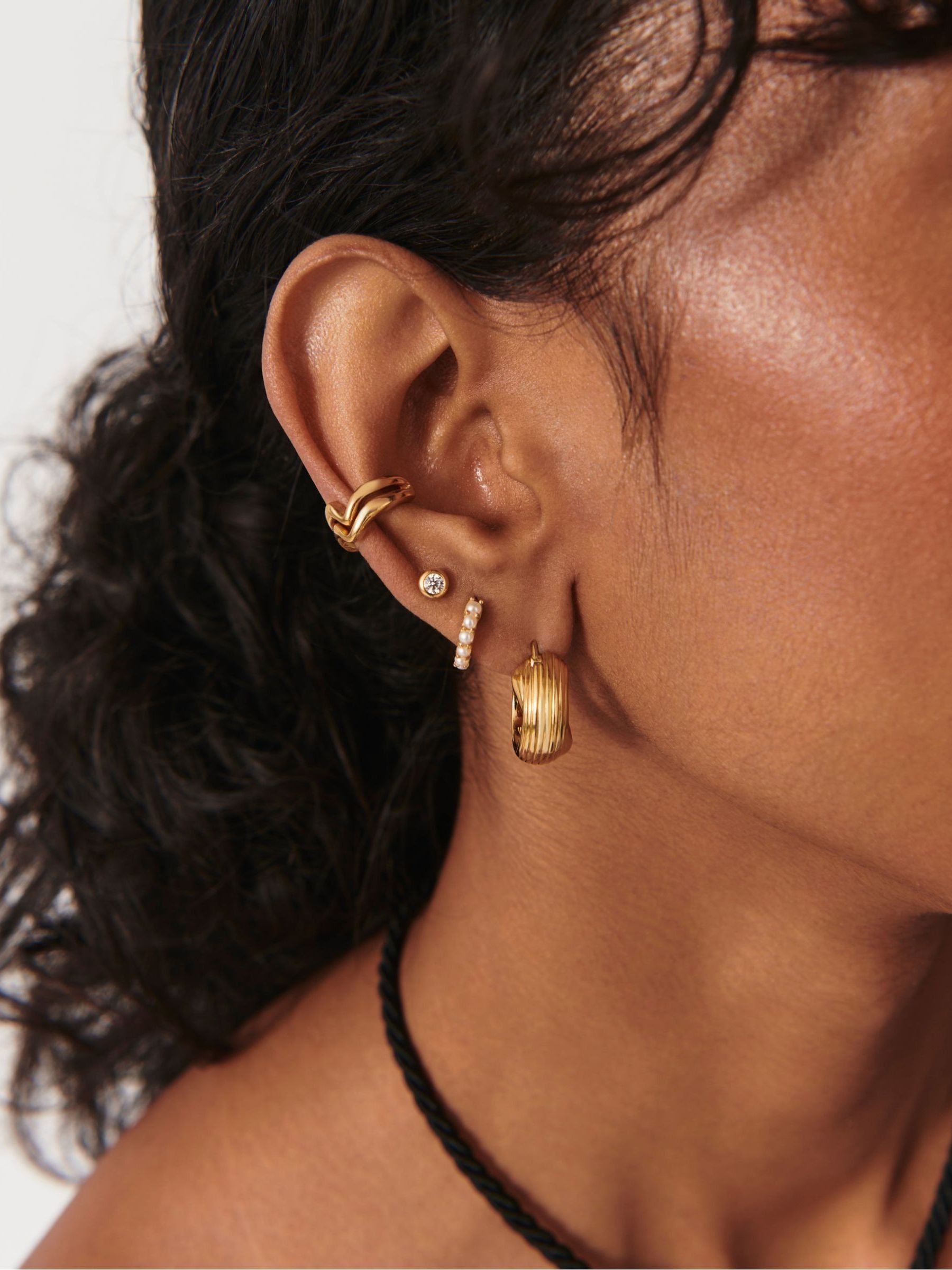Missoma gold vermeil pearl huggie earrings, imported from the UK