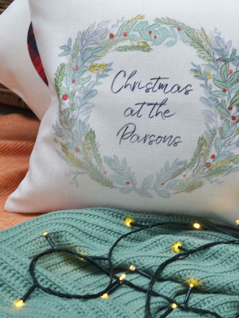 Solesmith linen wreath cushion personalised with family name (British brand)