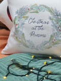 Solesmith linen wreath cushion personalised with family name (British brand)