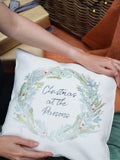 Solesmith linen wreath cushion personalised with family name (British brand)