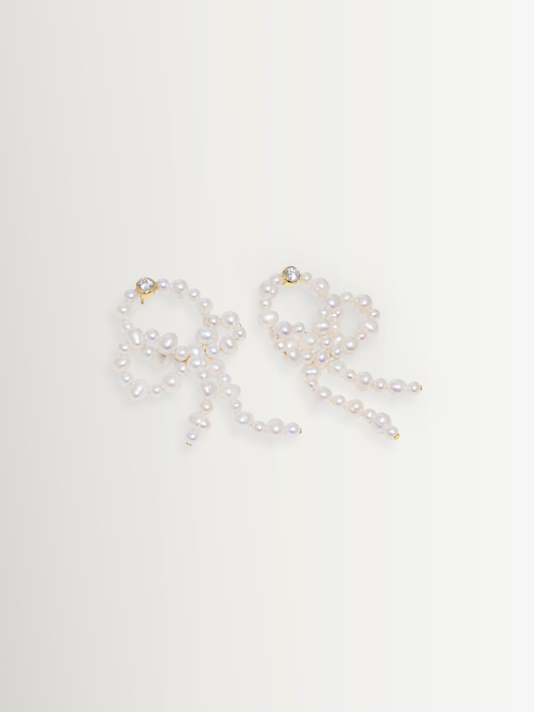 CompletedWorks loop-the-loop pearl earrings, UK version