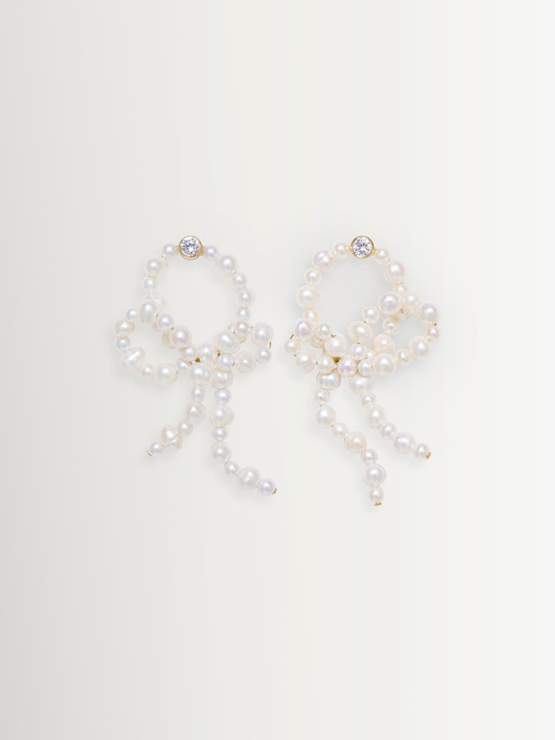 CompletedWorks loop-the-loop pearl earrings, UK version
