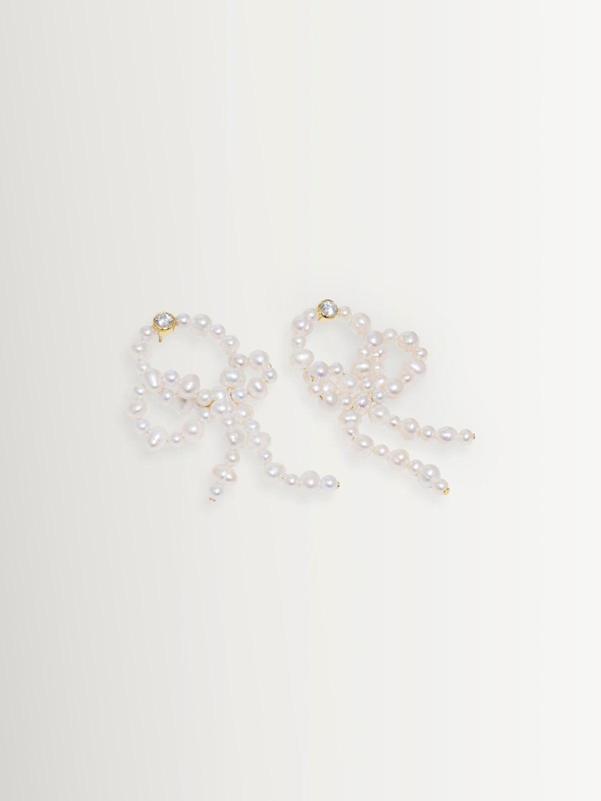 CompletedWorks loop-the-loop pearl earrings, UK version