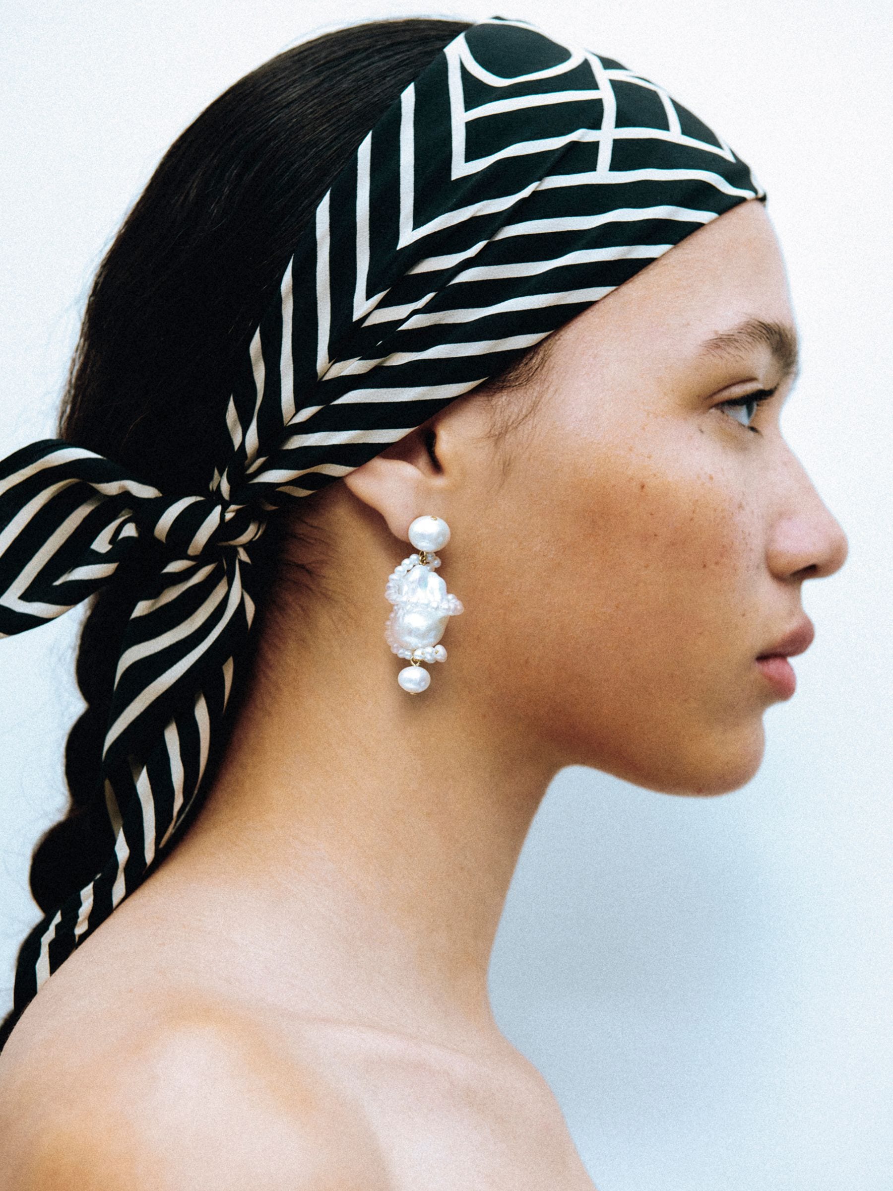 CompletedWorks gold pearl earrings 50mm, imported from the UK