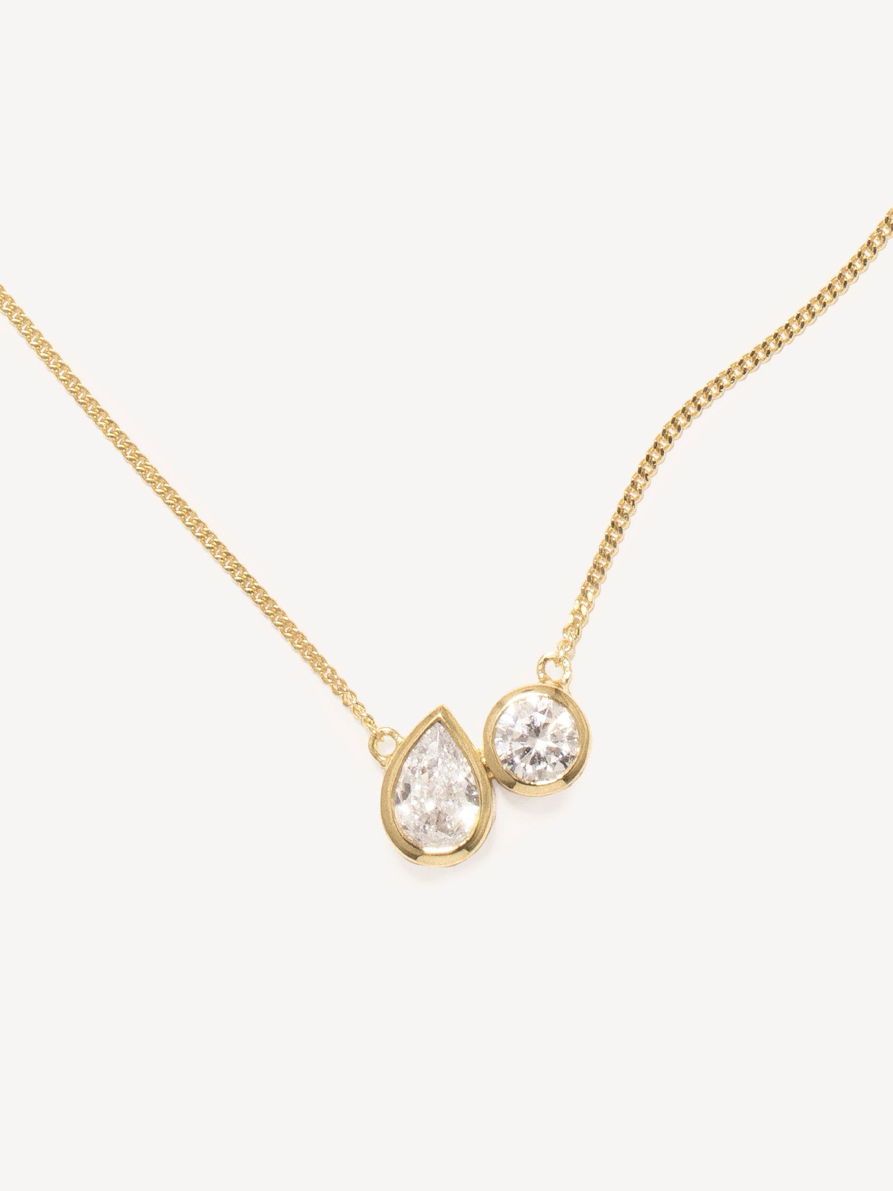 CompletedWorks gold tone peas in a pod necklace, imported from the UK