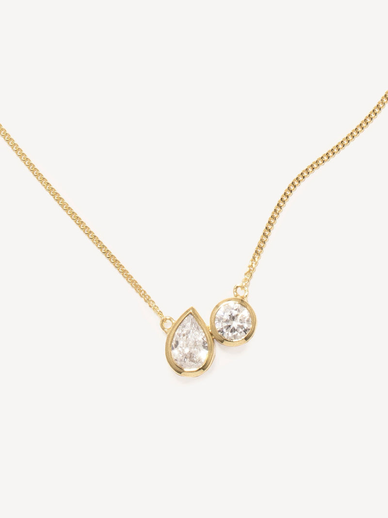 CompletedWorks gold tone peas in a pod necklace, imported from the UK