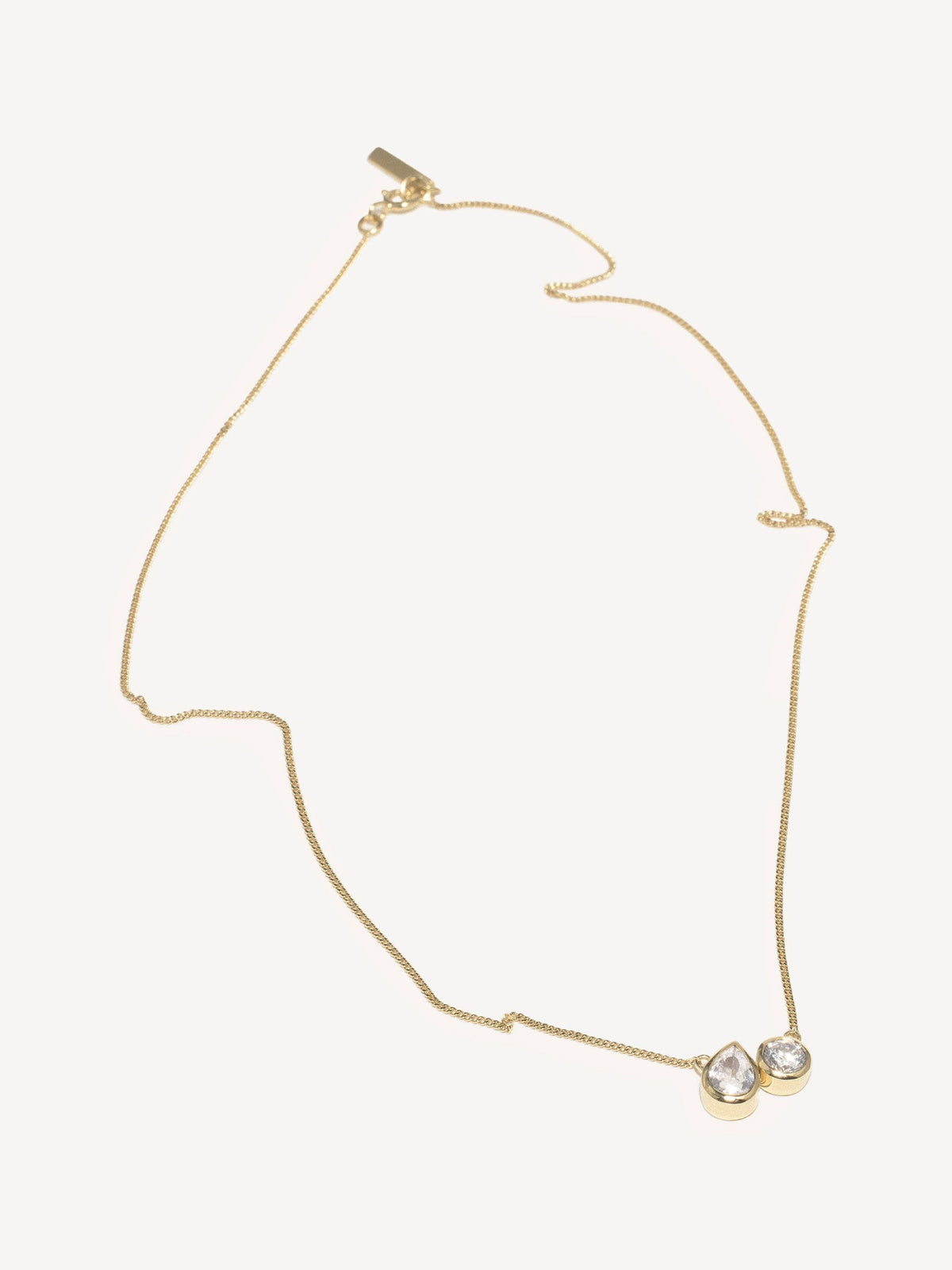 CompletedWorks gold tone peas in a pod necklace, imported from the UK