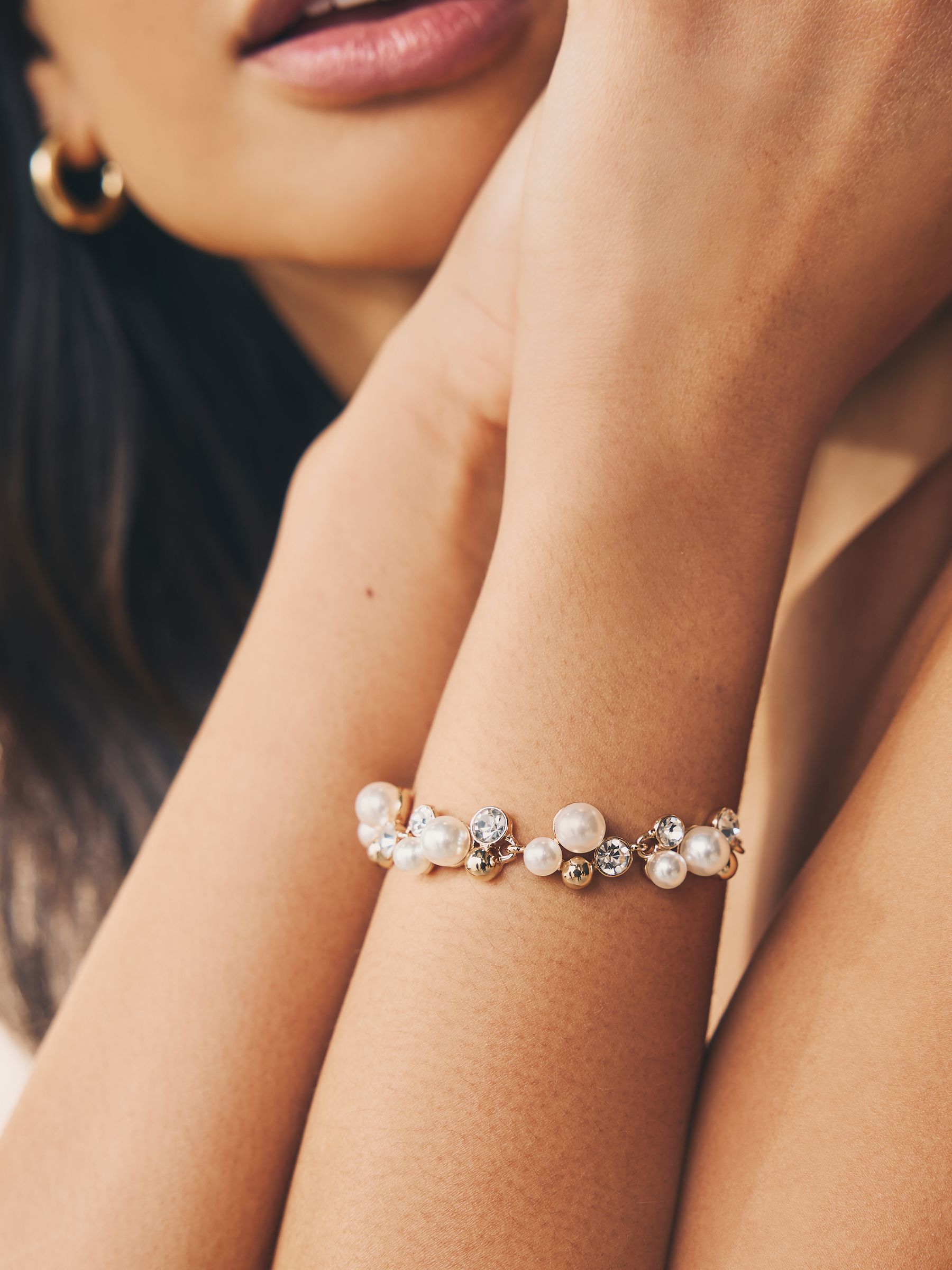 Gold tone sparkle pearl effect pully bracelet, UK version