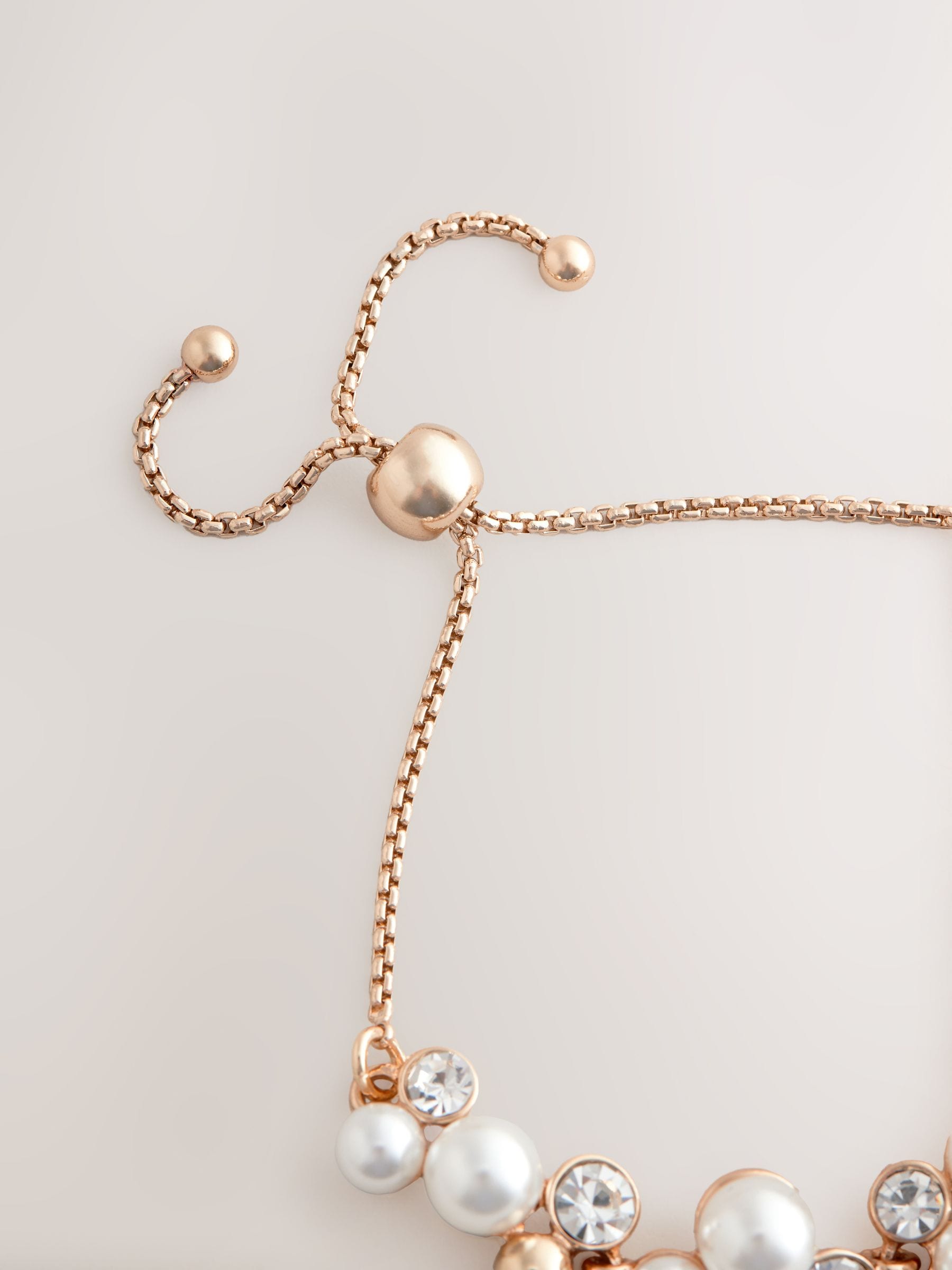 Gold tone sparkle pearl effect pully bracelet, UK version