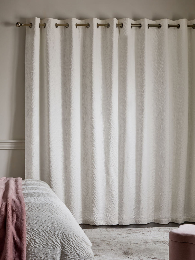 Cream embossed animal texture blackout eyelet curtains, UK version