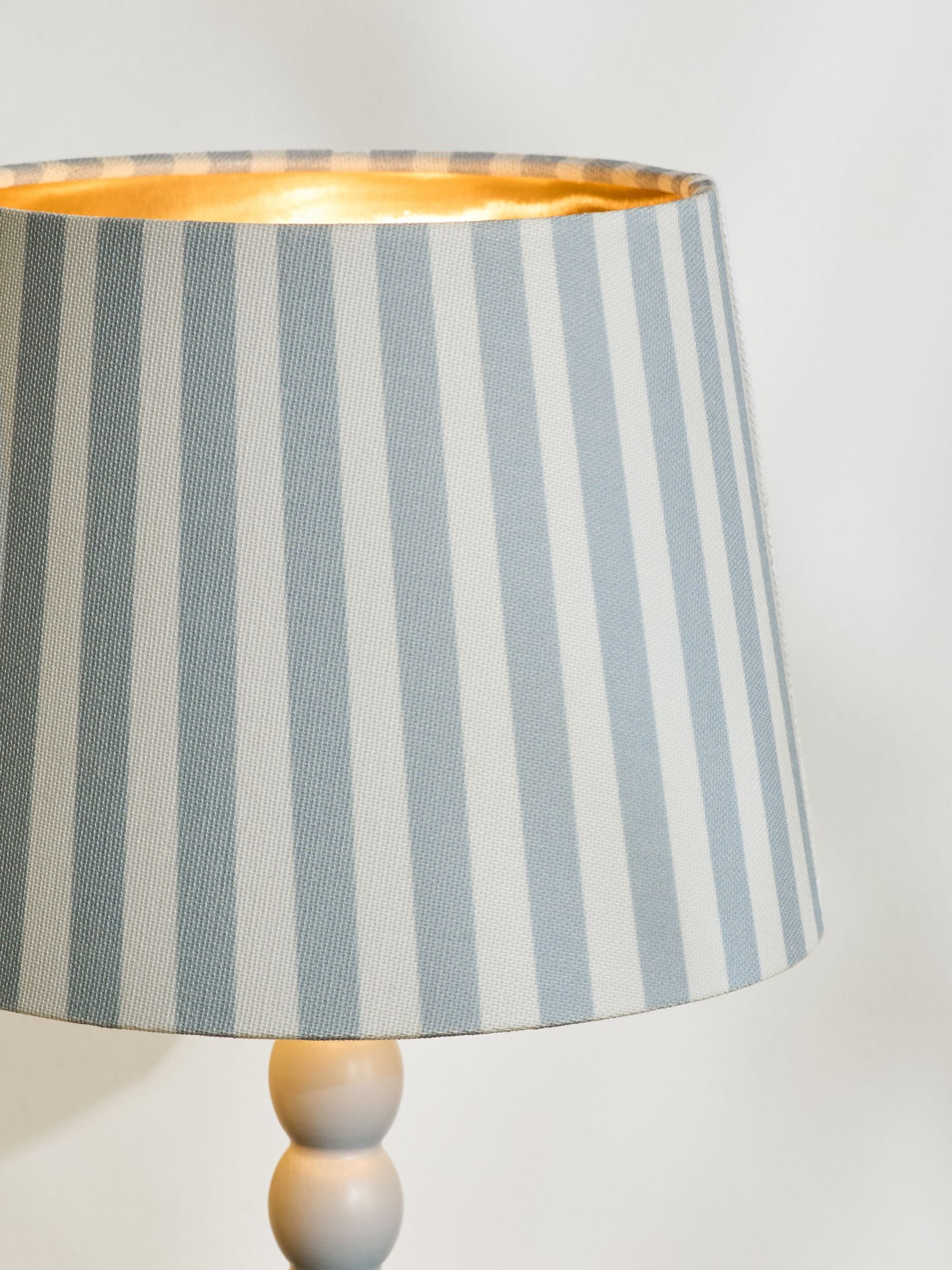 Blue Stripe Millie table lamp with beaded wood stem, imported from the UK