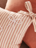 Pink velvet cushion with pearl bow detailing 30x50cm (British brand)