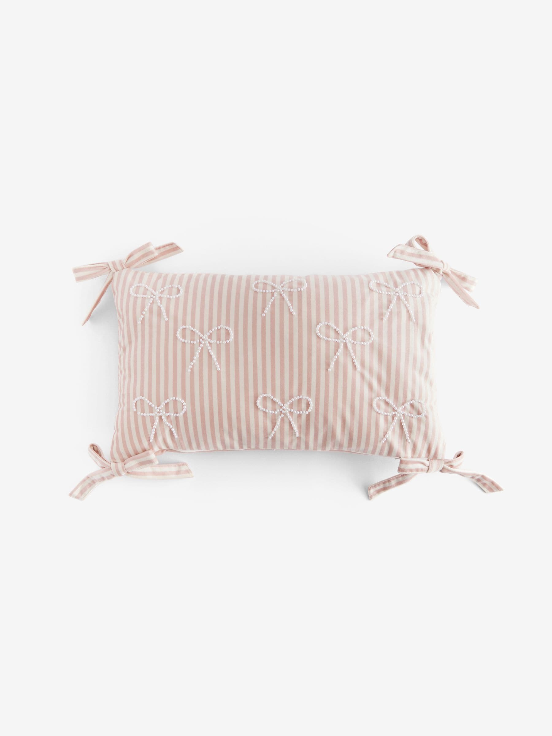 Pink velvet cushion with pearl bow detailing 30x50cm (British brand)