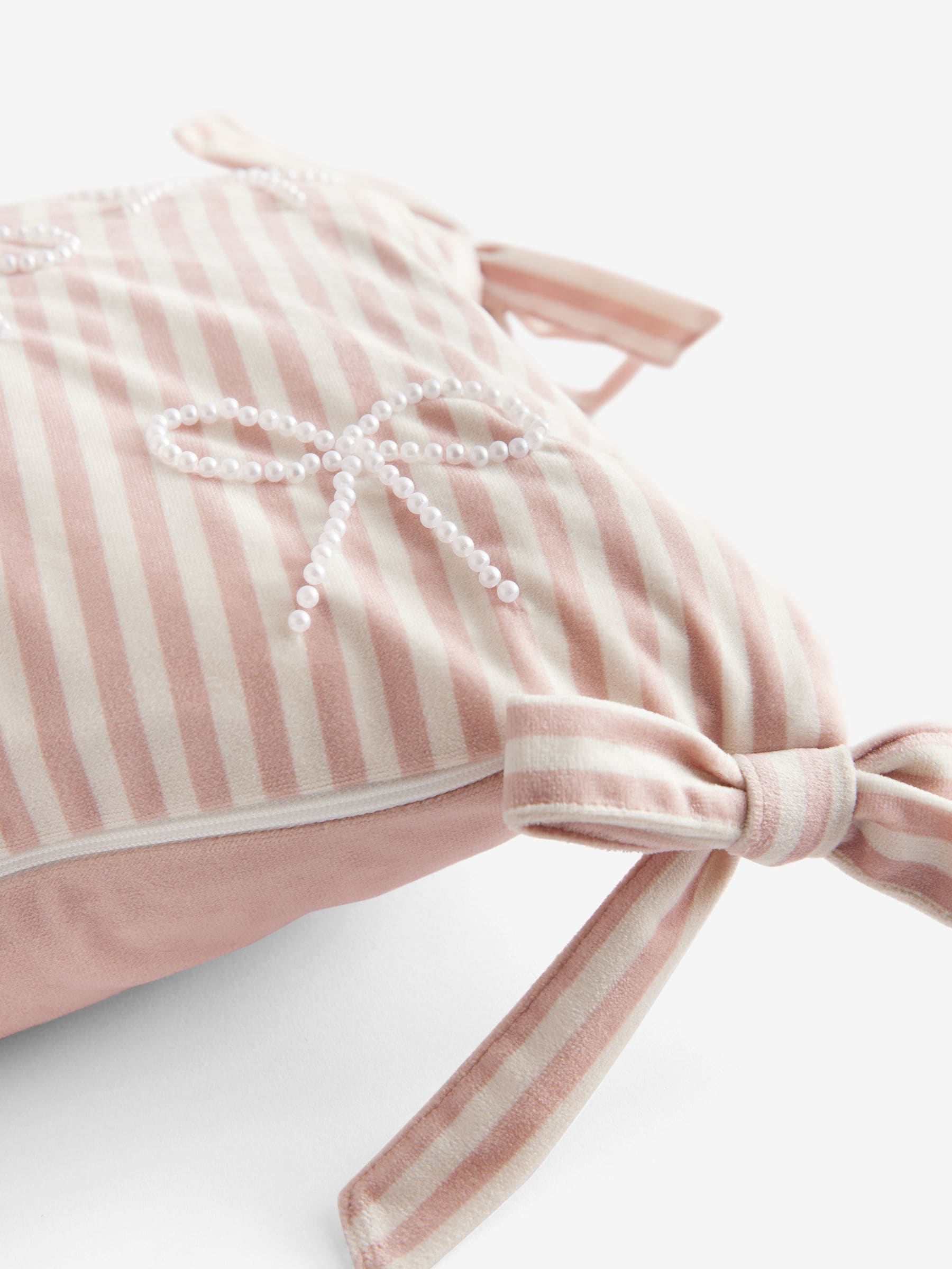 Pink velvet cushion with pearl bow detailing 30x50cm (British brand)