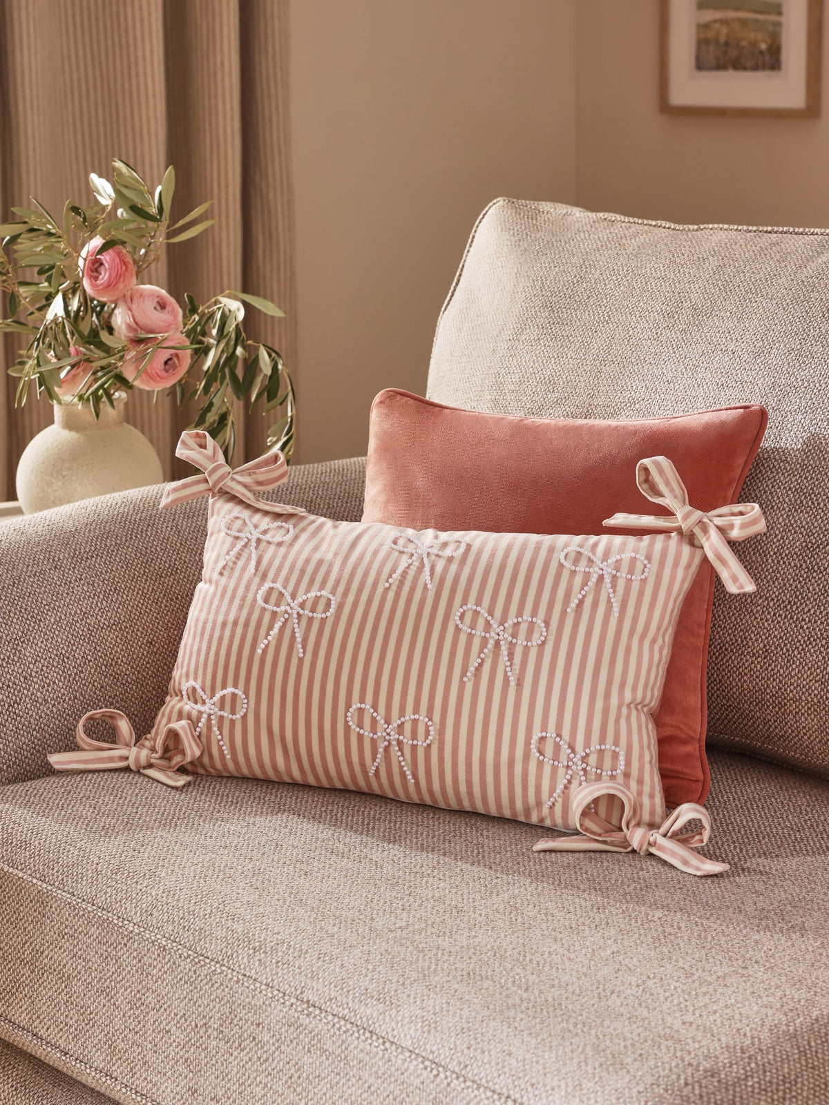 Pink velvet cushion with pearl bow detailing 30x50cm (British brand)