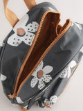 Black floral backpack with daisy design and adjustable straps, UK version
