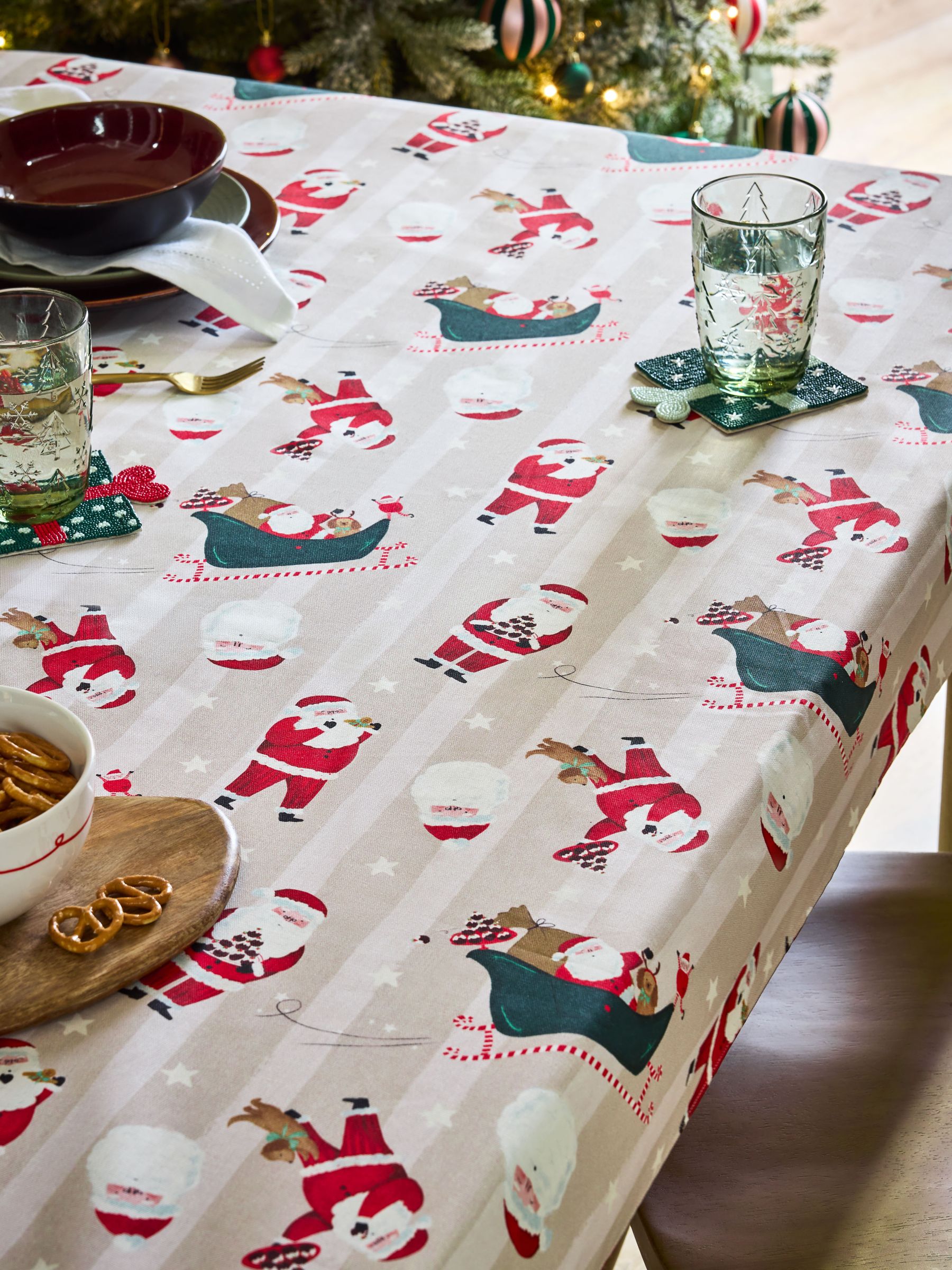 Red Christmas Santa Print Wipe Clean Tablecloth, imported from the UK