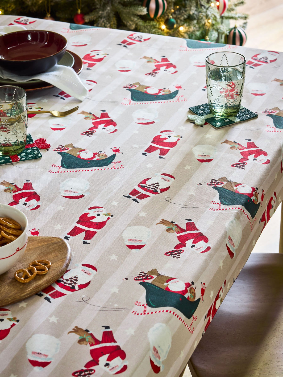 Red Christmas Santa Print Wipe Clean Tablecloth, imported from the UK