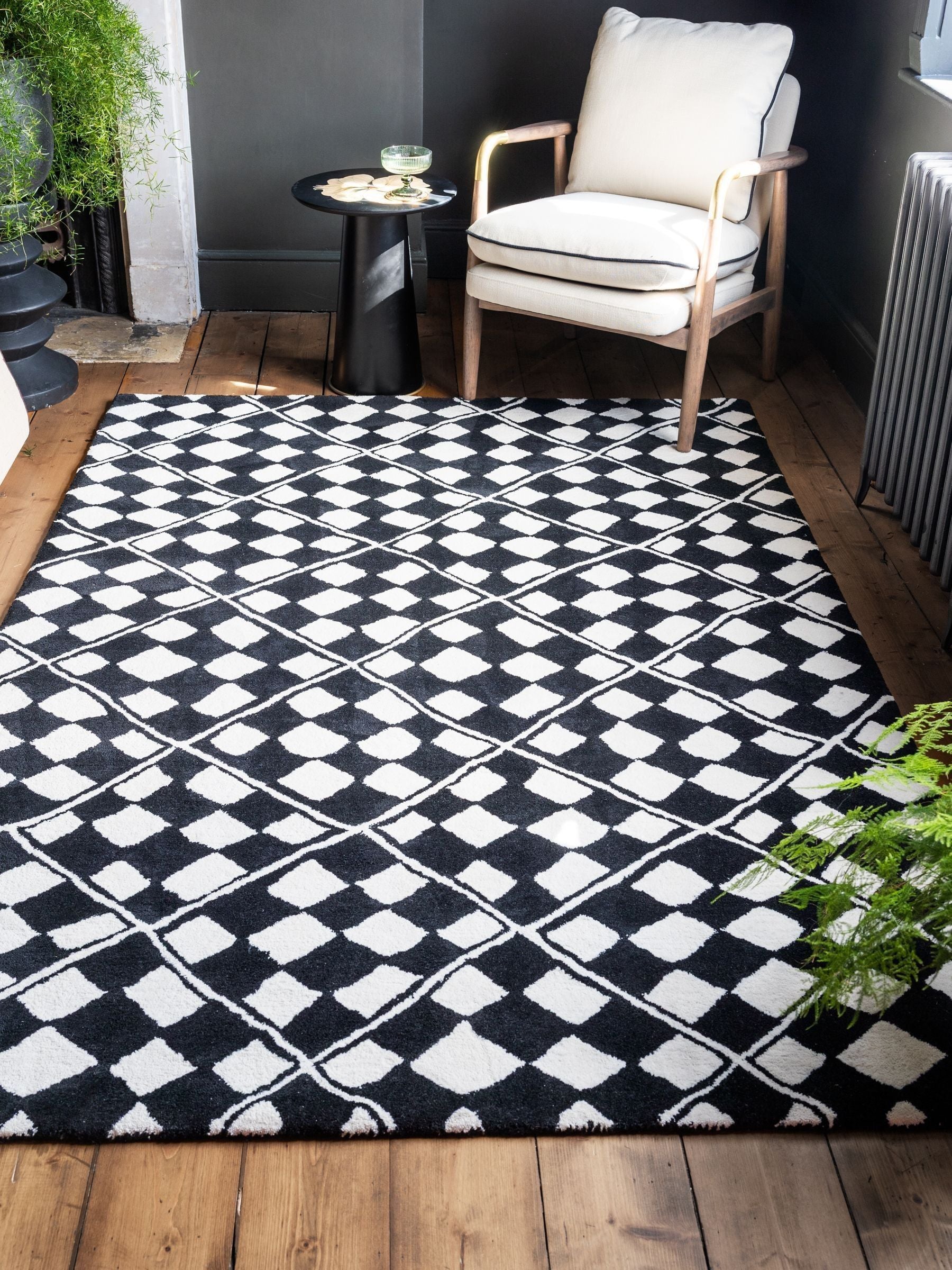 Rockett St George black checkerboard diamond tufted rug (British brand)
