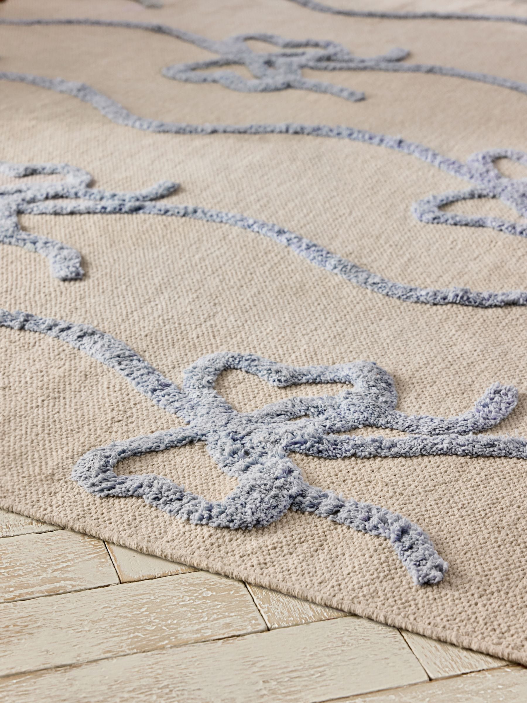 Cath Kidston blue ribbon and bows rug, imported from the UK