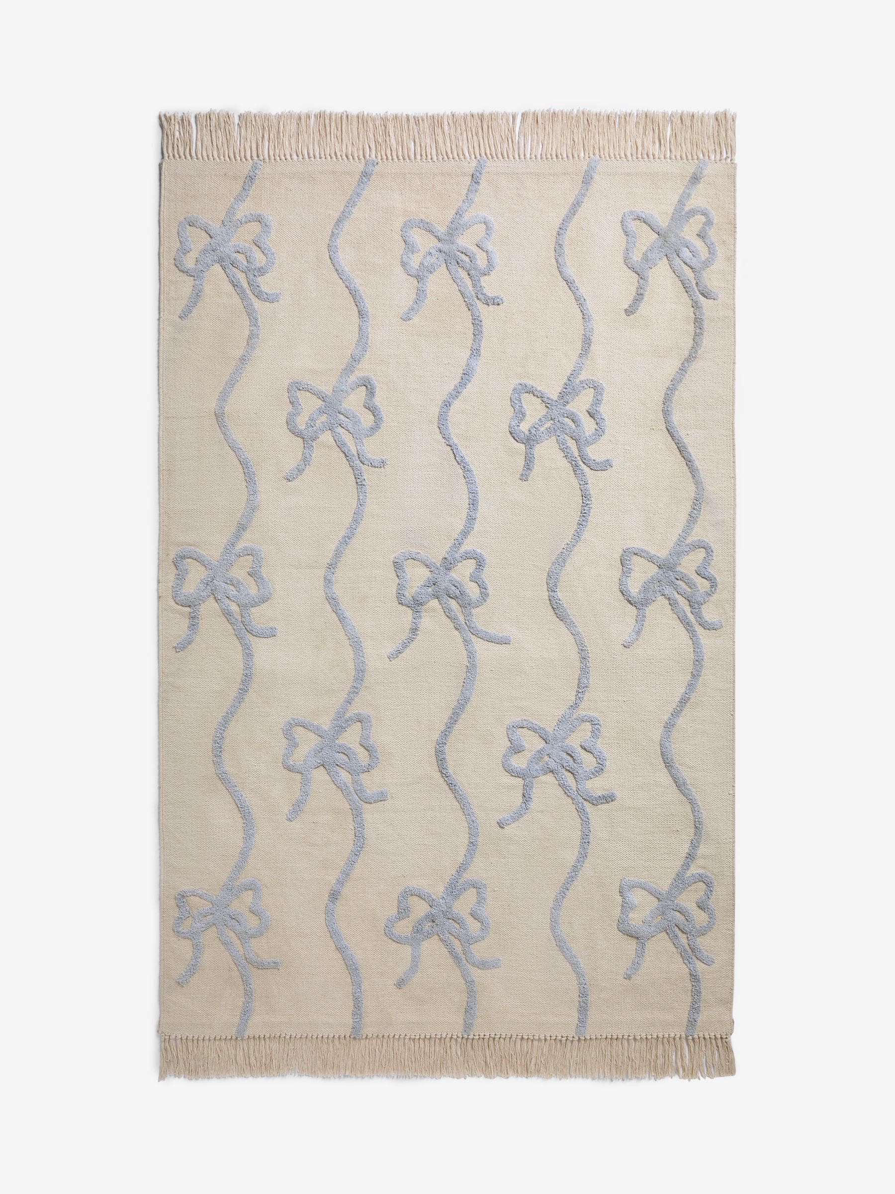Cath Kidston blue ribbon and bows rug, imported from the UK