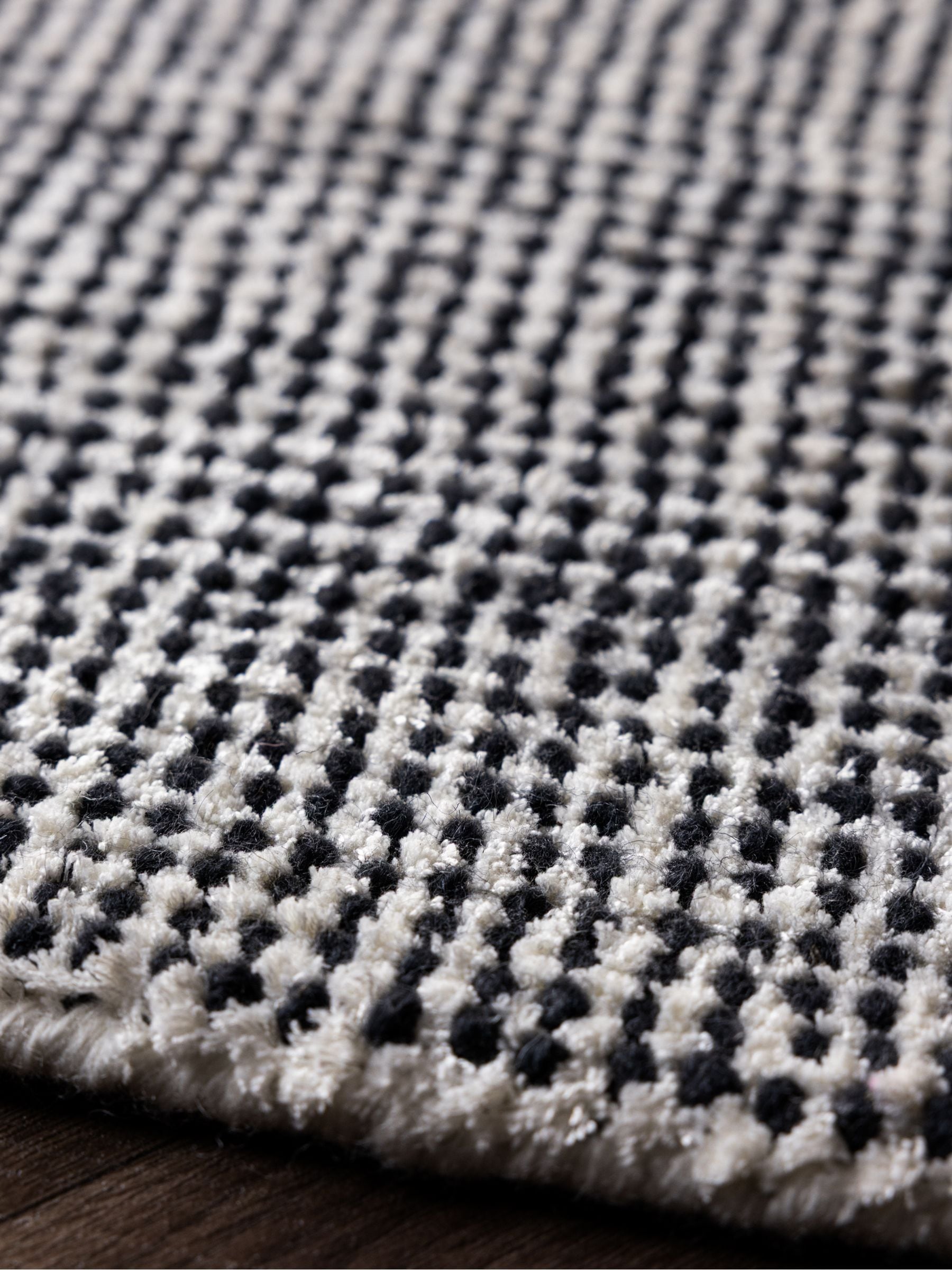 Rockett St George black dotty tufted rug, UK version