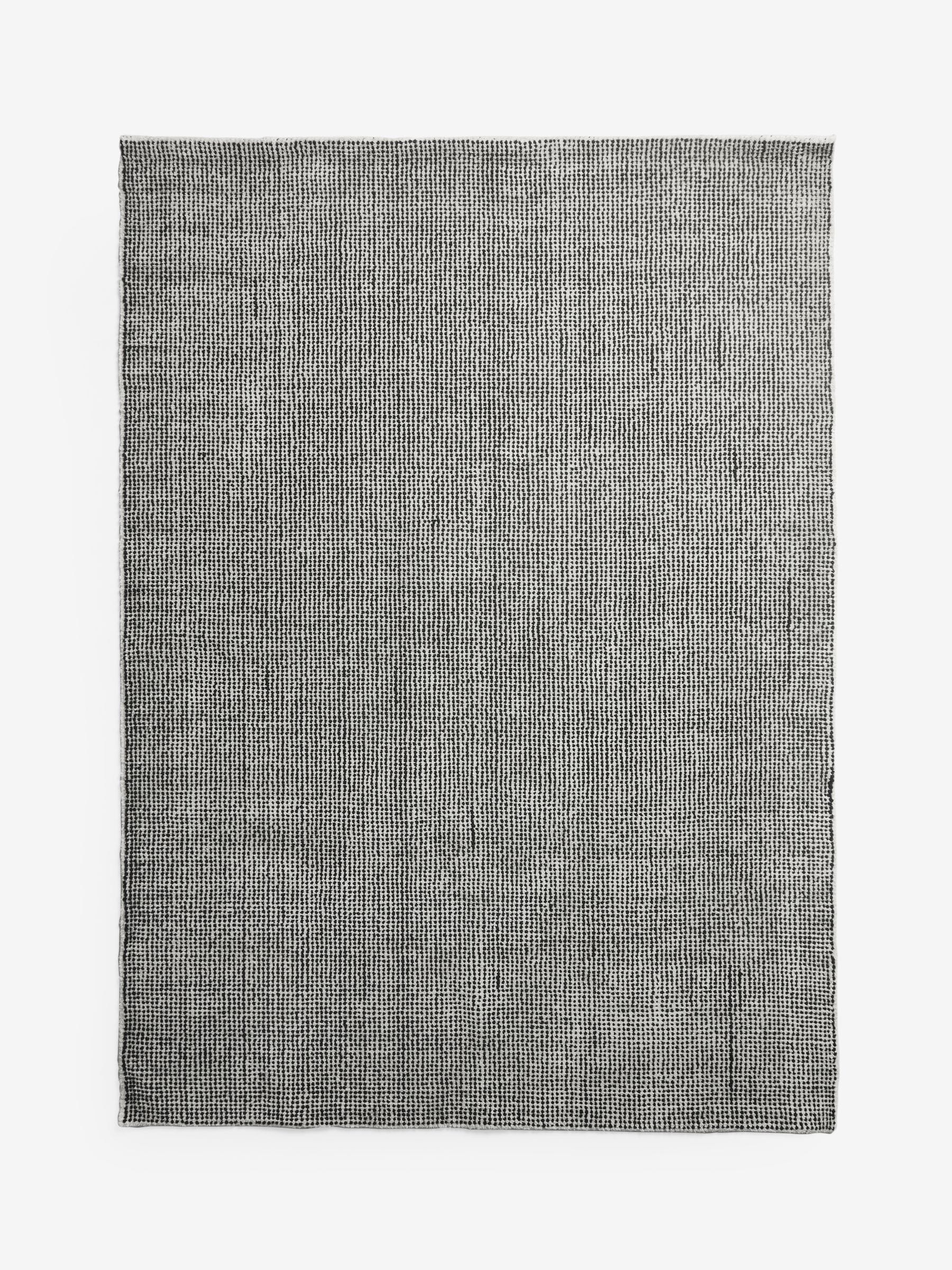 Rockett St George black dotty tufted rug, UK version